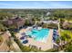 Community pool and clubhouse with surrounding landscape at 7121 Orchid Island Pl, Bradenton, FL 34202