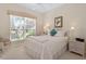 Bright bedroom with queen-size bed and large window at 7121 Orchid Island Pl, Bradenton, FL 34202