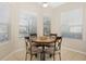 Bright breakfast nook with a round table and four chairs, perfect for casual dining at 7121 Orchid Island Pl, Bradenton, FL 34202