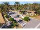 Grand entrance to a luxurious community, featuring palm trees and ornate landscaping at 7121 Orchid Island Pl, Bradenton, FL 34202