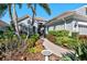 Welcoming front yard with landscaping and brick walkway at 7121 Orchid Island Pl, Bradenton, FL 34202