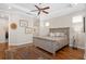 Main bedroom with hardwood floors, king bed, ceiling fan and access to the backyard at 7121 Orchid Island Pl, Bradenton, FL 34202