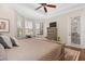 King-size bed, dresser, and backyard access in this bright main bedroom at 7121 Orchid Island Pl, Bradenton, FL 34202