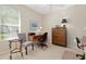 Home office with desk, chair, and ample storage at 7121 Orchid Island Pl, Bradenton, FL 34202