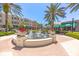 Scenic town square with water fountain, shops, and palm trees at 7121 Orchid Island Pl, Bradenton, FL 34202