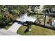 An aerial view showcasing a house with a metal roof, driveway, and yard at 7307 9Th Nw Ave, Bradenton, FL 34209