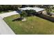 Single-story house with a metal roof, driveway, and spacious yard at 7307 9Th Nw Ave, Bradenton, FL 34209