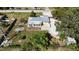 Aerial view of a single-story house with a large backyard and surrounding trees at 7307 9Th Nw Ave, Bradenton, FL 34209