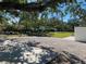 Large backyard with gravel area and mature trees at 7307 9Th Nw Ave, Bradenton, FL 34209