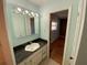 Bathroom with vanity, mirror and view of bedroom at 7307 9Th Nw Ave, Bradenton, FL 34209