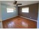 Spacious bedroom with hardwood floors and two windows offering natural light at 7307 9Th Nw Ave, Bradenton, FL 34209