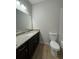 Bathroom with granite countertop and dark wood cabinets at 7560 Plantation Cir, Bradenton, FL 34201