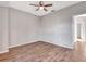 Well-lit bedroom with wood flooring and ceiling fan at 7560 Plantation Cir, Bradenton, FL 34201