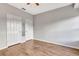 Bright bedroom with wood-look floors and double closets at 7560 Plantation Cir, Bradenton, FL 34201