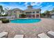 Relaxing community pool with surrounding patio at 7560 Plantation Cir, Bradenton, FL 34201