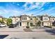 Two-story townhomes with attached garages and landscaping at 7560 Plantation Cir, Bradenton, FL 34201