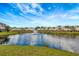 Community lake with fountain and beautiful landscaping at 7560 Plantation Cir, Bradenton, FL 34201