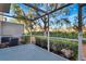 Peaceful screened patio with view of trees and landscaping at 7560 Plantation Cir, Bradenton, FL 34201