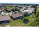 Aerial view of community, featuring homes, golf course, and lush landscaping at 8240 Parkside Dr, Englewood, FL 34224