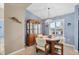 Bright dining area with wood table and chairs, built-in hutch, and light-filled window at 8240 Parkside Dr, Englewood, FL 34224