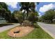 Community entrance sign of Oyster Creek, with landscaping at 8240 Parkside Dr, Englewood, FL 34224