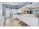 Efficient kitchen with white appliances and a breakfast nook at 8240 Parkside Dr, Englewood, FL 34224