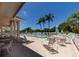 Inviting pool area with lounge chairs and patio tables at 8240 Parkside Dr, Englewood, FL 34224