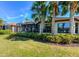 Backyard view showcasing the lanai and landscaping, perfect for enjoying the outdoors in a peaceful setting at 8279 Varenna Dr, Sarasota, FL 34231