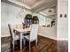 Stylish dining room featuring modern lighting, hardwood floors, and ample seating at 8279 Varenna Dr, Sarasota, FL 34231