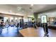 Well-equipped gym with treadmills, weights, exercise bikes and mirrors providing a complete fitness experience at 8279 Varenna Dr, Sarasota, FL 34231