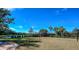 Outdoor volleyball court surrounded by lush landscaping, perfect for friendly games and exercise at 8279 Varenna Dr, Sarasota, FL 34231