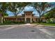 Inviting community clubhouse featuring well-manicured landscaping and ample parking at 854 Rosemary Cir, Bradenton, FL 34212