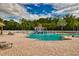 Resort-style community pool with a splash pad and plenty of lounge chairs for relaxation at 854 Rosemary Cir, Bradenton, FL 34212