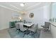 Elegant dining room with chandelier and gray upholstered chairs at 854 Rosemary Cir, Bradenton, FL 34212