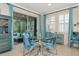 Casual dining area with glass table and blue patterned chairs at 854 Rosemary Cir, Bradenton, FL 34212