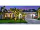 Attractive two-story home with palm trees and landscape lighting at 854 Rosemary Cir, Bradenton, FL 34212