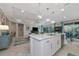 Modern kitchen with large island, white cabinets, and stainless steel appliances at 854 Rosemary Cir, Bradenton, FL 34212