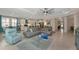 Bright living room with gray sectional and open floor plan at 854 Rosemary Cir, Bradenton, FL 34212