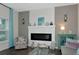 Living room with fireplace, light teal accents and wood floors at 854 Rosemary Cir, Bradenton, FL 34212