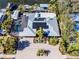 Aerial view showing home with solar panels and lush landscaping at 903 20Th W Ave, Palmetto, FL 34221