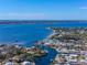 Aerial view of waterfront homes and canals with boats and lush vegetation at 903 20Th W Ave, Palmetto, FL 34221