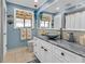 Coastal-themed bathroom with granite vanity, vessel sink, and updated fixtures at 903 20Th W Ave, Palmetto, FL 34221