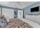 Main bedroom with white dresser, blue and beige bedding, and hardwood floors at 903 20Th W Ave, Palmetto, FL 34221