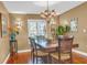 Bright dining room with hardwood floors, chandelier, and seating for six at 903 20Th W Ave, Palmetto, FL 34221