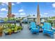 Relaxing dock with blue chairs and potted plants at 903 20Th W Ave, Palmetto, FL 34221