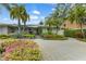 Home exterior showcasing landscaping and a paver driveway at 903 20Th W Ave, Palmetto, FL 34221