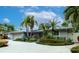 Charming mid-century home with a lush tropical landscape at 903 20Th W Ave, Palmetto, FL 34221