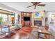 Living room features a fireplace, built-ins and hardwood floors at 903 20Th W Ave, Palmetto, FL 34221