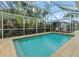 Inviting screened-in pool with a spacious deck at 903 20Th W Ave, Palmetto, FL 34221