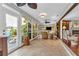 Relaxing sunroom with tiled floors, wicker furniture, and water views at 903 20Th W Ave, Palmetto, FL 34221